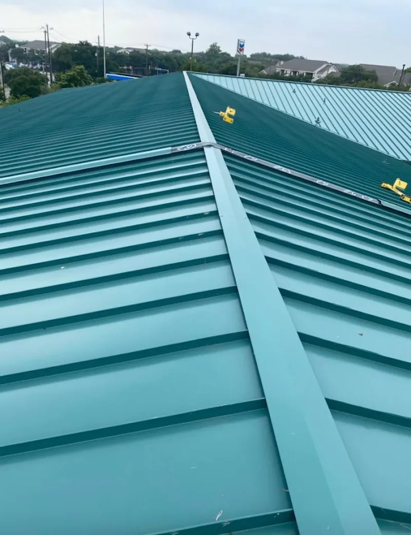 Green commercial metal roof ridge and valley for Metal Roof Repair in Katy