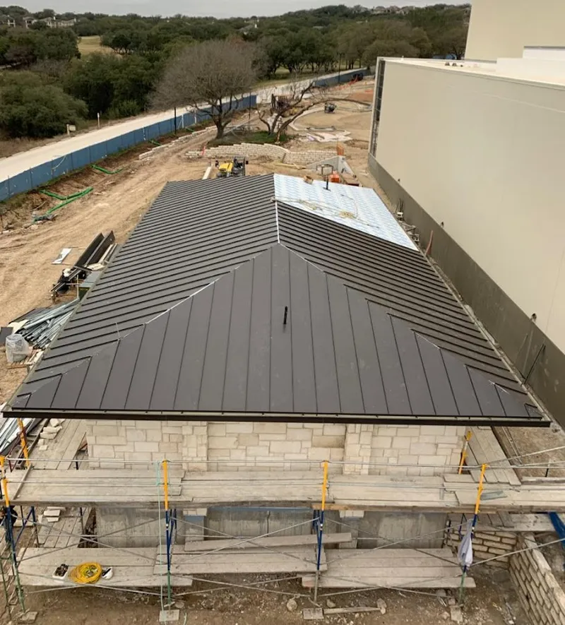 Metal roof new construction with scaffolding in Katy