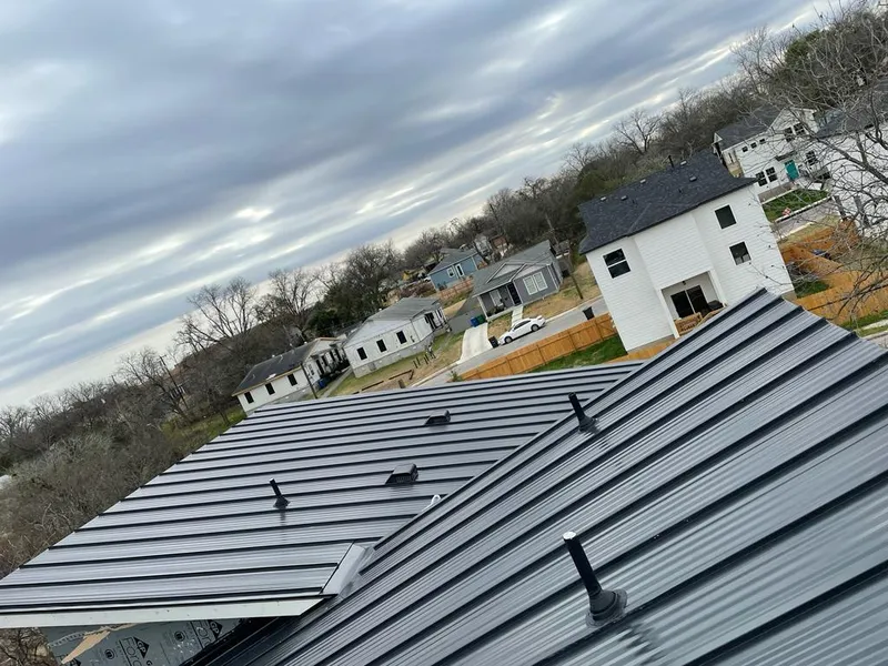 Standing seam metal roof panels with vents for Skylight Repair in Katy